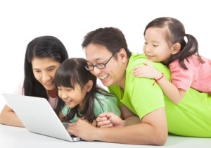 Happy Family With Computer